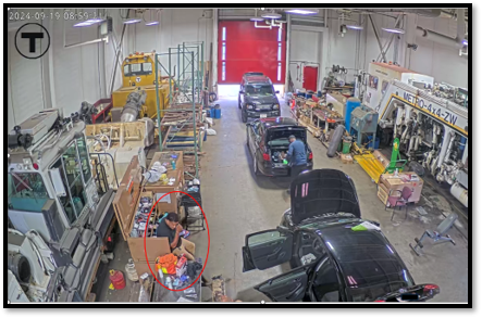 video surveillance depicted Vicente (circled in red below) sitting inside of Cabot Garage holding his cellular phones.  Source DOJ